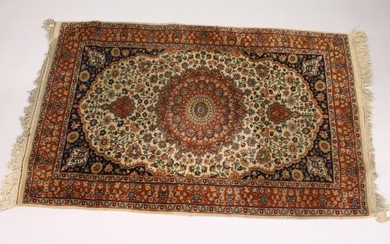 A SMALL KASHAN RUG, 20th Century beige ground with