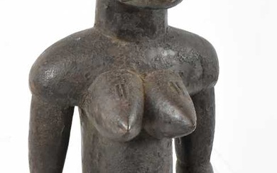 A Tiv, Nigeria, large figure with incised detail mounted on...