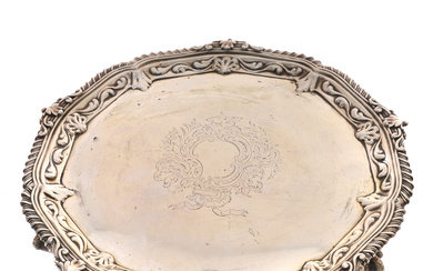 A VICTORIAN SHAPED CIRCULAR SILVER SALVER IN GEORGE III STYLE.