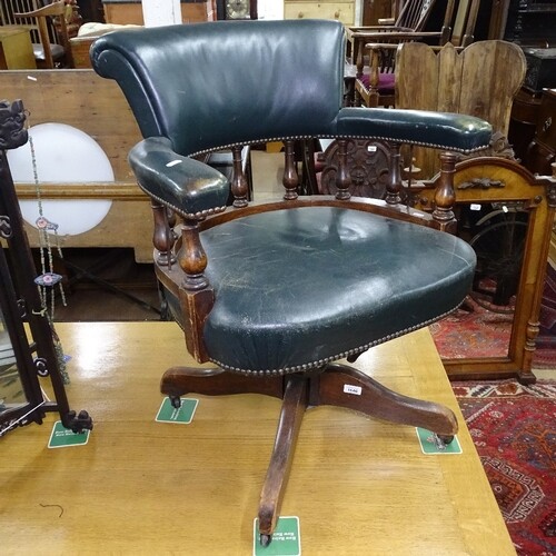 A Victorian green leather-upholstered swivel desk chair