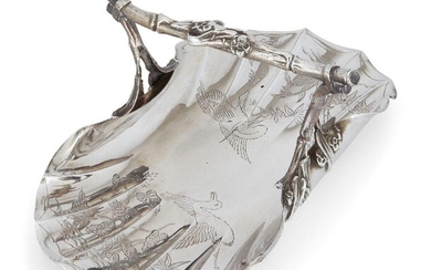 A Victorian silver 'Chinoiserie' basket, London, c.1886, Goldsmiths' Alliance Ltd., the flat, fluted base engraved with Chinese-inspired bird, bamboo and foliate decoration to a stylised twig handle, 26.5cm long, 16.6cm wide, approx. weight 14.5oz