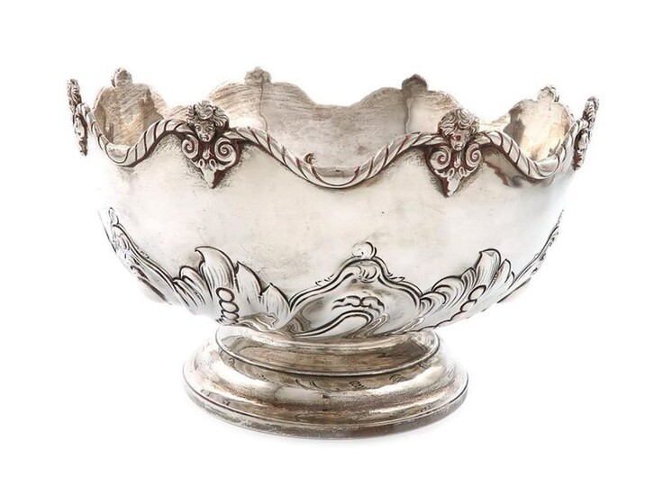 A Victorian silver rose bowl, by Gibson and Langman, London 1897, circular form, swirl-fluted and beaded decoration, scroll border with cherubs, on a circular foot, diameter 27cm, approx. weight 29.9oz.