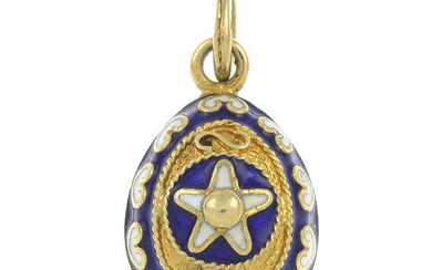 A blue and white enamel egg pendant.