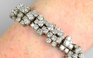 A brilliant-cut diamond abstract cluster line bracelet.