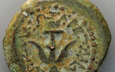 A bronze prutah of Alexander Jannaeus. Obv.: Anchor surrounded...