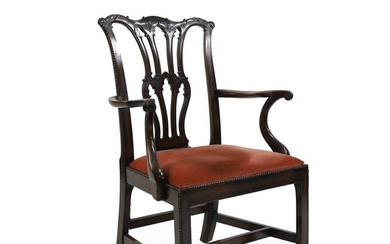 A carved mahogany elbow chair