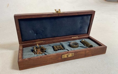A cased set of four miniature marine instruments, comprising two...