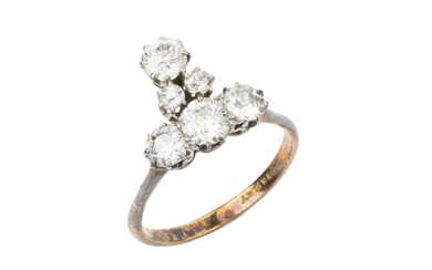 A diamond cluster ring, set with four principal and two...