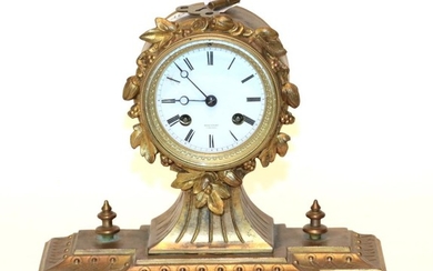 A gilt metal striking mantel clock, retailed by Wheatley, Carlisle...
