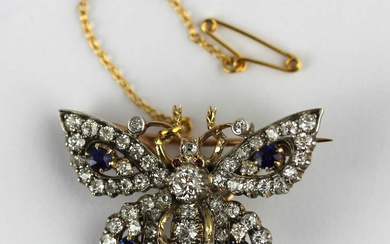 A gold backed and silver set diamond and sapphire brooch