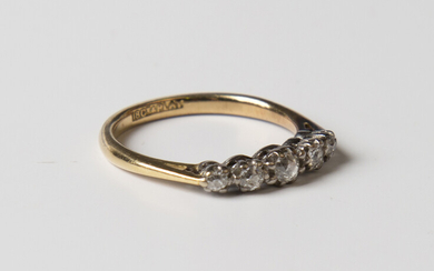 A gold, platinum and diamond five stone ring, mounted with a row of cushion cut diamonds graduating