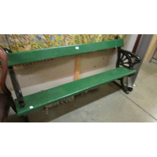 A heavy cast iron and timber bench (painted green and black)...