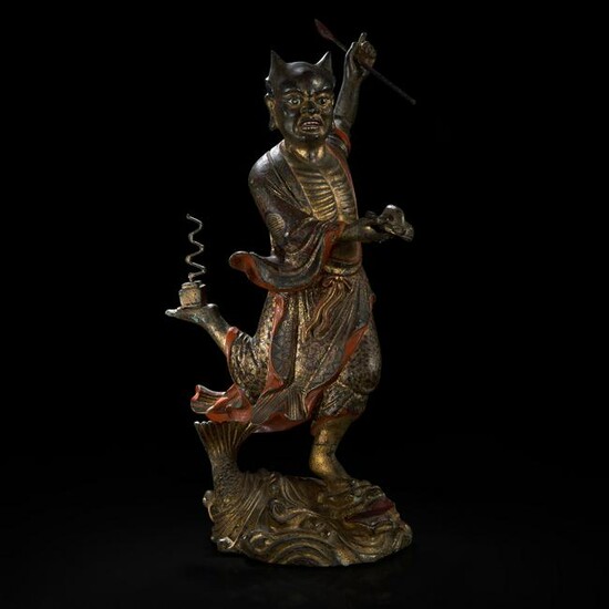 A large Chinese gilt and lacquered bronze figure of