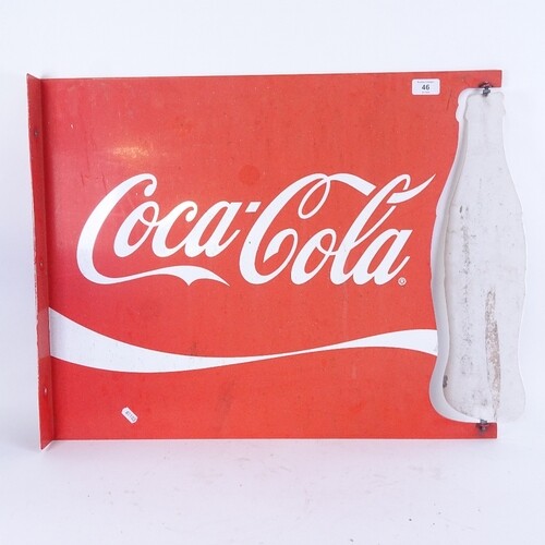 A large Vintage red and white Coca-Cola advertising sign, wi...