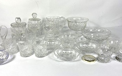 A large group of decorative moulded and cut table glass, including biscuit barrels, jugs, tazza
