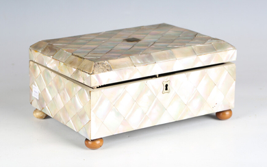 A late 19th century mother-of-pearl veneered rectangular workbox with silk-lined interior and vegeta