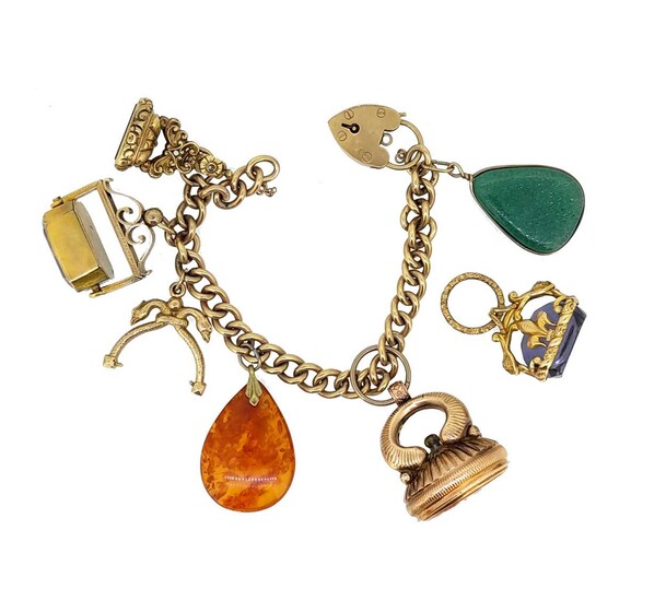 A late 20th century charm bracelet with assorted charms