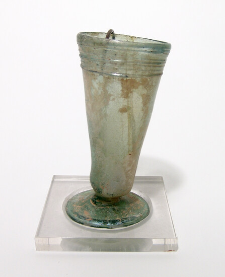 A late Roman glass footed cup with custom stand