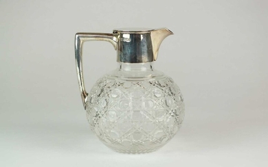 A late Victorian silver mounted glass claret jug