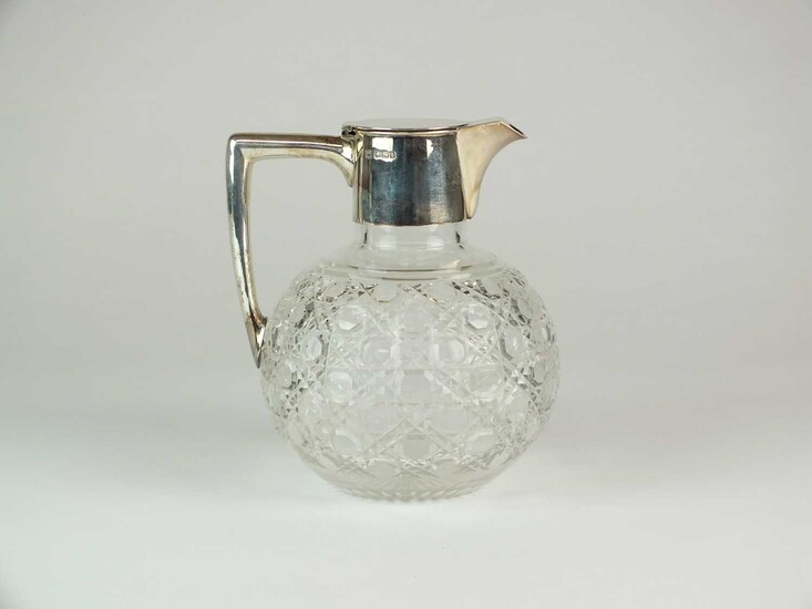 A late Victorian silver mounted glass claret jug
