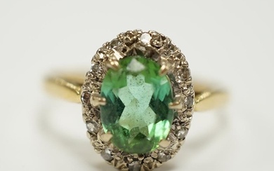 A modern 18ct gold, green tourmaline and diamond set oval cl...
