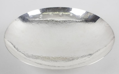 A modern silver dish, of circular footed form, with