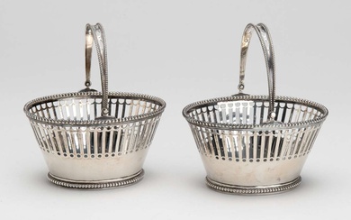 A pair of Dutch silver sweetmeat baskets with swing handle