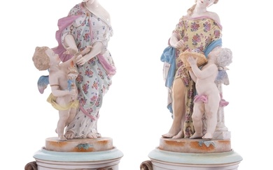 A pair of French porcelain figure groups and stands in the f...