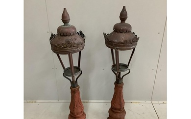 A pair of Victorian copper and cast iron lamps, height 122cm...