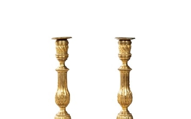A pair of gilt-bronze candlesticks, Louis XVI late 18th century | Paire de flambeaux en bronze doré d'époque Louis XVI, fin du XVIIIe siècle