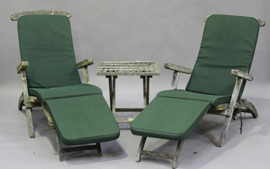 A pair of late 20th century teak folding garden steamer chairs, fitted with loose cushions, height 9