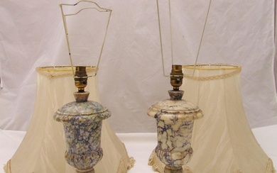 A pair of marble table lamps on marble rectangular plinths w...