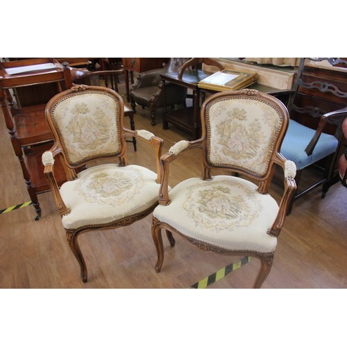 A pair of reproduction carved beech fauteuils with tapestry ...