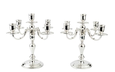 A pair of silver four branch five-light candelabra, the baluster...