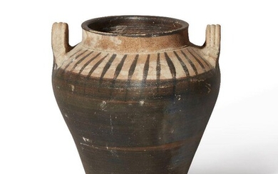 A pottery vessel with tapering body, looped handles ei at the shoulder, Not Ancient, 19.8cm Provenance: Private London collection formed between the 1980s-1990s.