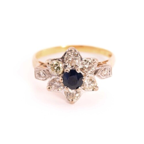 A sapphire and diamond flower head ring in 18ct gold, compos...