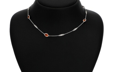 NOT SOLD. A sapphire and diamond necklace set with numerous oval-cut orange sapphires and diamonds,...