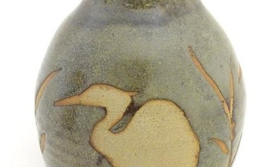 A studio pottery glazed vase of ovoid form with a flare