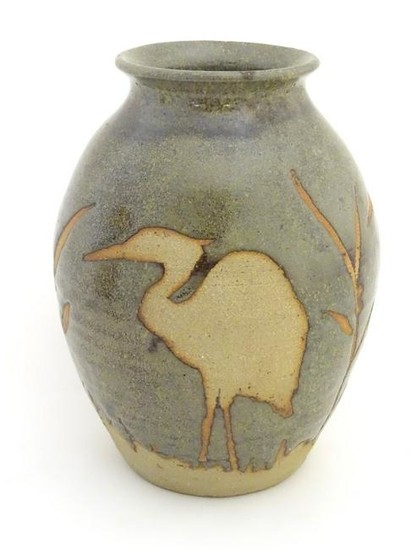 A studio pottery glazed vase of ovoid form with a flare