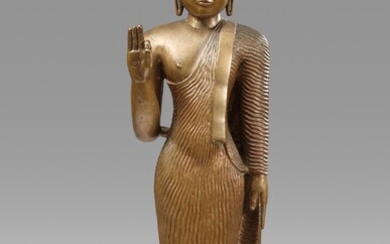 A tall Sri Lankan copper alloy figure of Buddha Shakyamuni. 18th/19th century