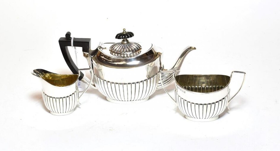 A three-piece Victorian silver tea service, by John Henry Potter,...