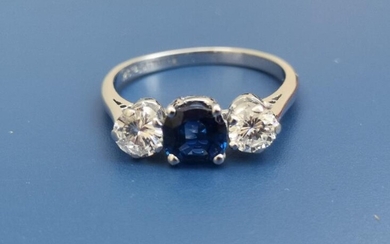A three stone sapphire & diamond claw set ring...