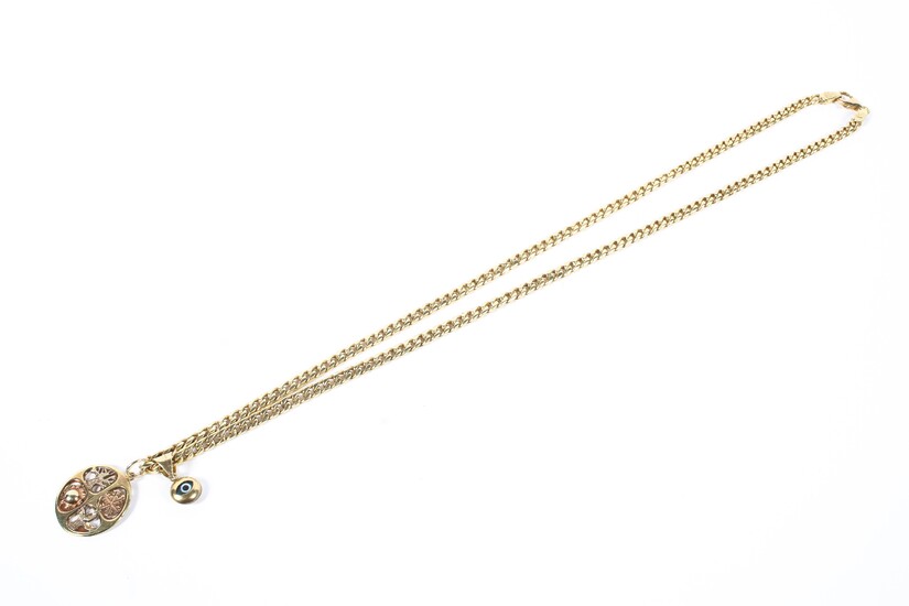 A yellow metal curb link necklace chain