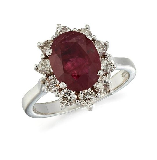 AN 18CT WHITE GOLD RUBY AND DIAMOND CLUSTER RING, an