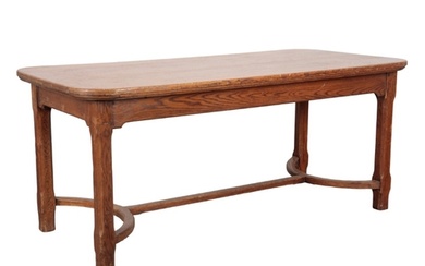 AN EARLY 20TH CENTURY OAK DINING TABLE in the manner of Lut...