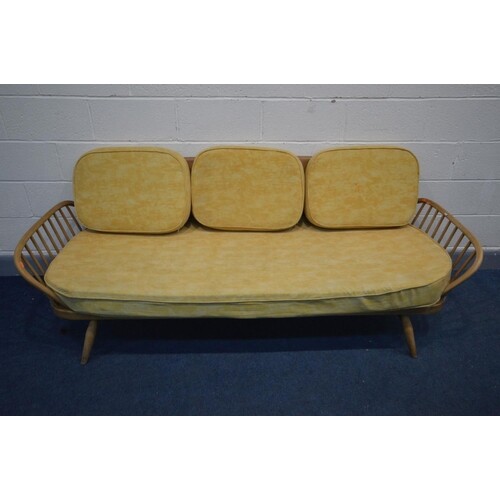 AN ERCOL BLONDE ELM AND BEECH STUDIO COUCH, MODEL 355, with ...