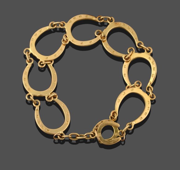 An 18 Carat Gold Horseshoe Motif Bracelet, seven horseshoe motifs...