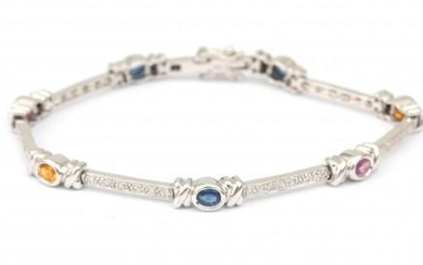 An 18 karat white gold sapphire and diamond bracelet. Composed of elongated links set with blue, yellow and pink sapphires, alternated with brilliant cut diamonds. Forty diamonds in total, ca. 0.40 ct., ca. G-H, ca. VS. Gross weight: 16.2 g.