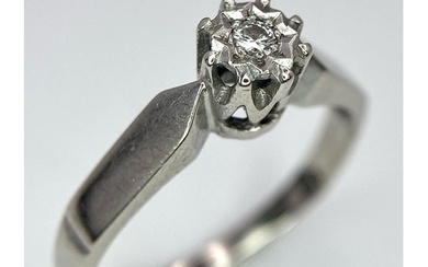 An 18K White Gold Diamond Solitaire Ring. Size M. 2.61g