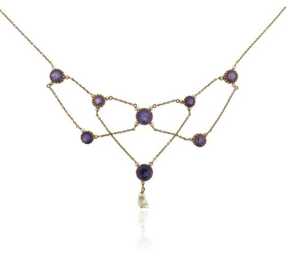 An Edwardian amethyst and seed pearl necklace, suspending...
